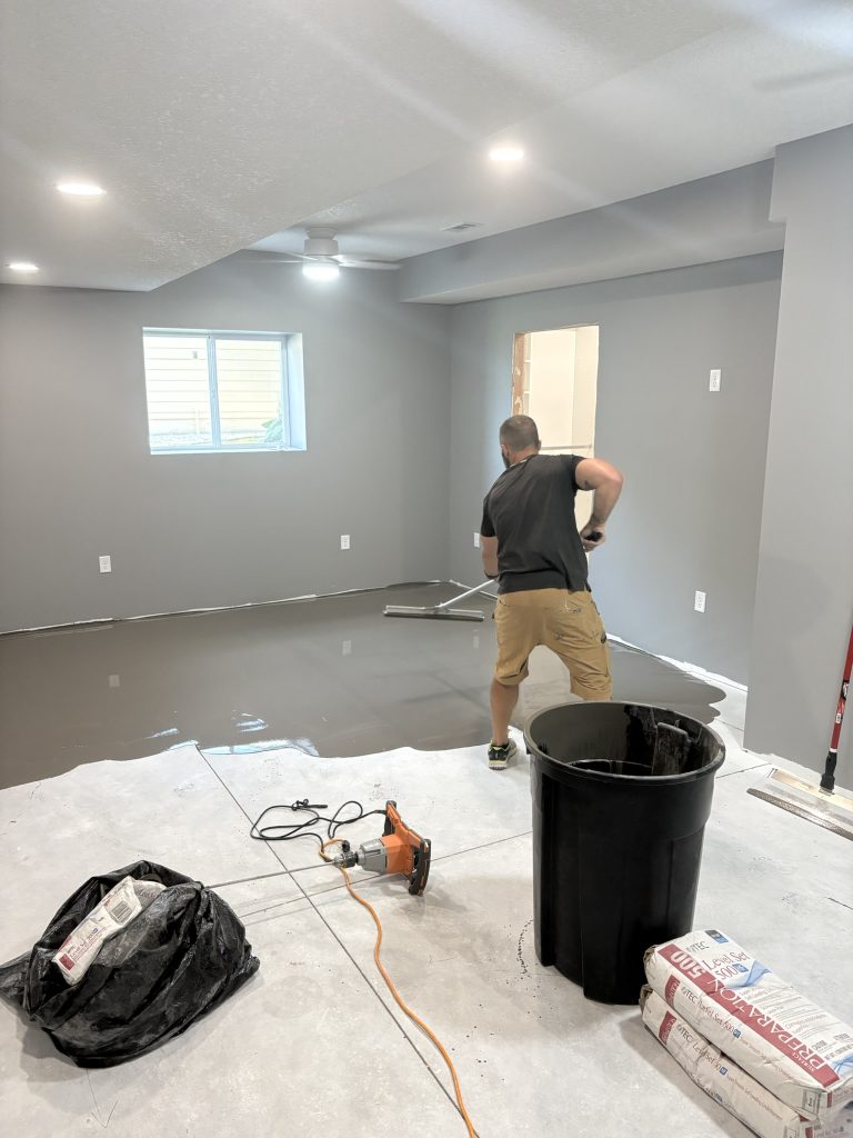 basement-remodel-flooring-resurface-prep-topeka-ks Key cost driver in basement finishing including floor leveling costs before flooring is installed to level concrete